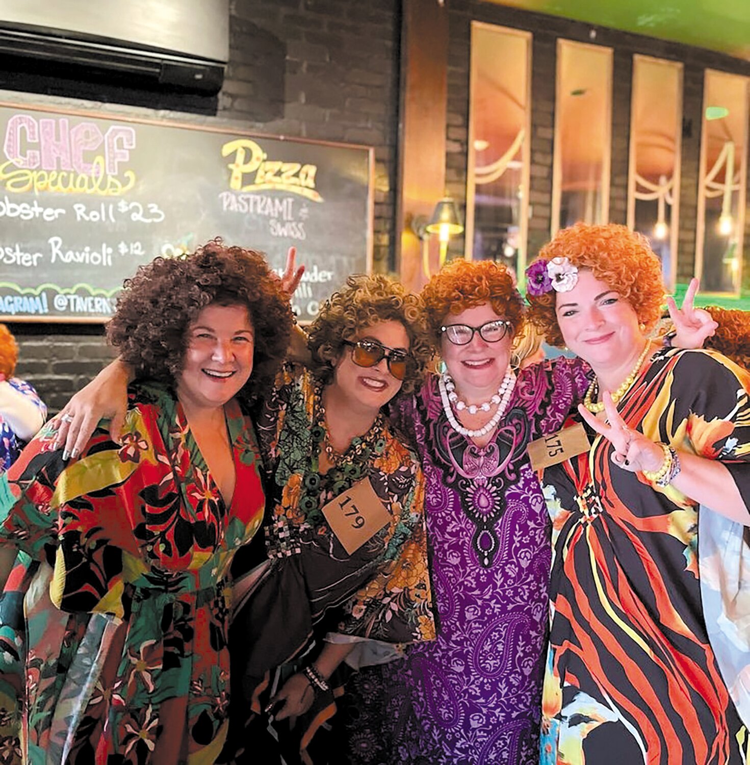 ALL DRESSED UP WITH SOMEWHERE TO GO: Bastan, right, celebrates in full costume in Providence alongside other Mrs. Ropers Jen Volpe, left , Nina Nappa and  Lisa Peterson. (Photo courtesy of Elizabeth Bastan)